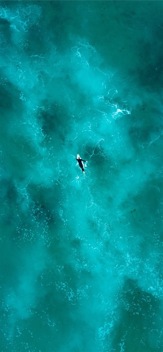 man surfing during daytime iPhone X wallpaper 
