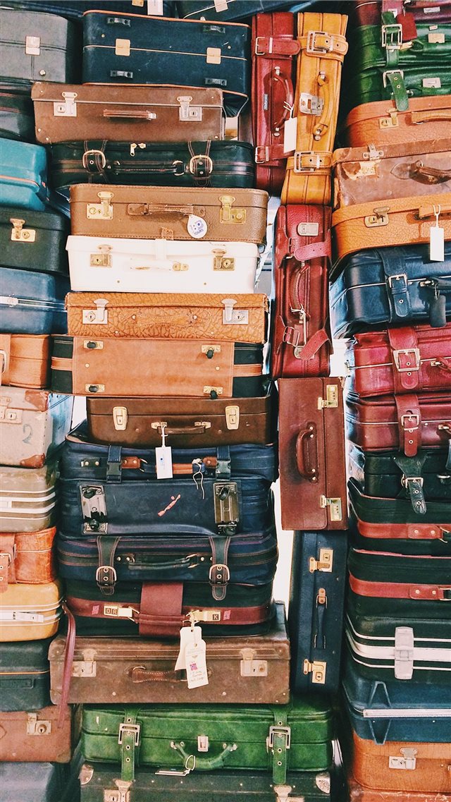 pile of luggages iPhone 8 wallpaper 