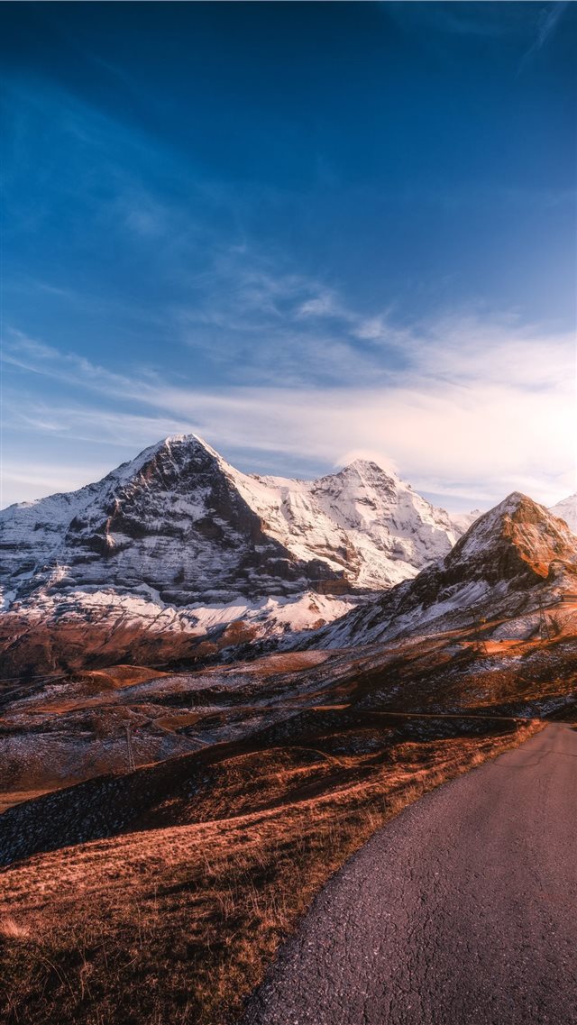 roadway beside iced capped mountain during daytime iPhone 8 wallpaper 