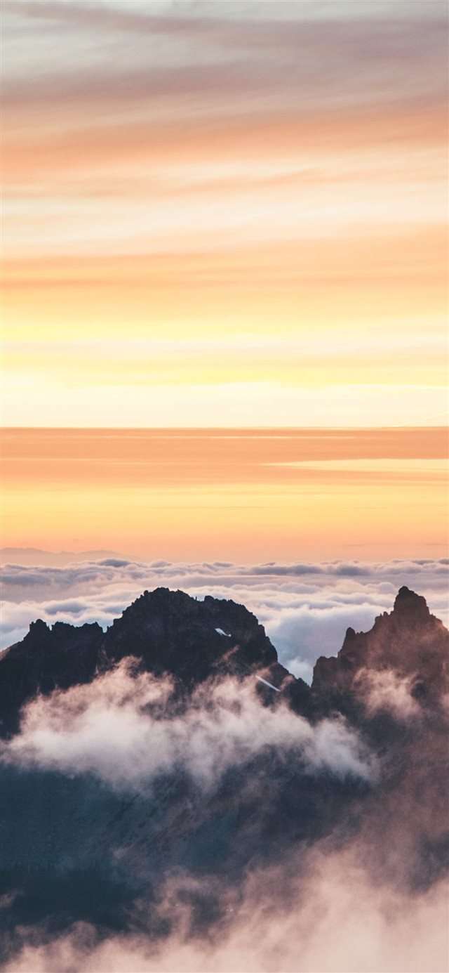 top view of mountain covered by clouds iPhone X wallpaper 