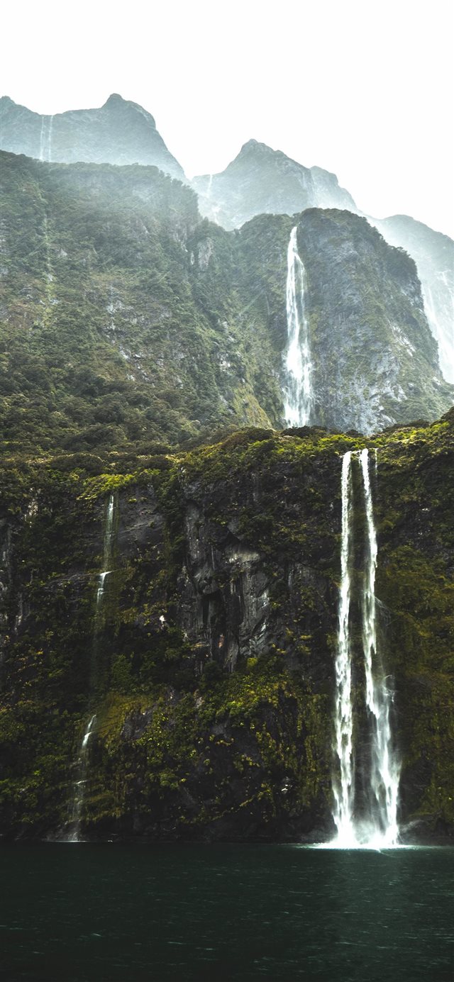 waterfalls under white sky iPhone X wallpaper 