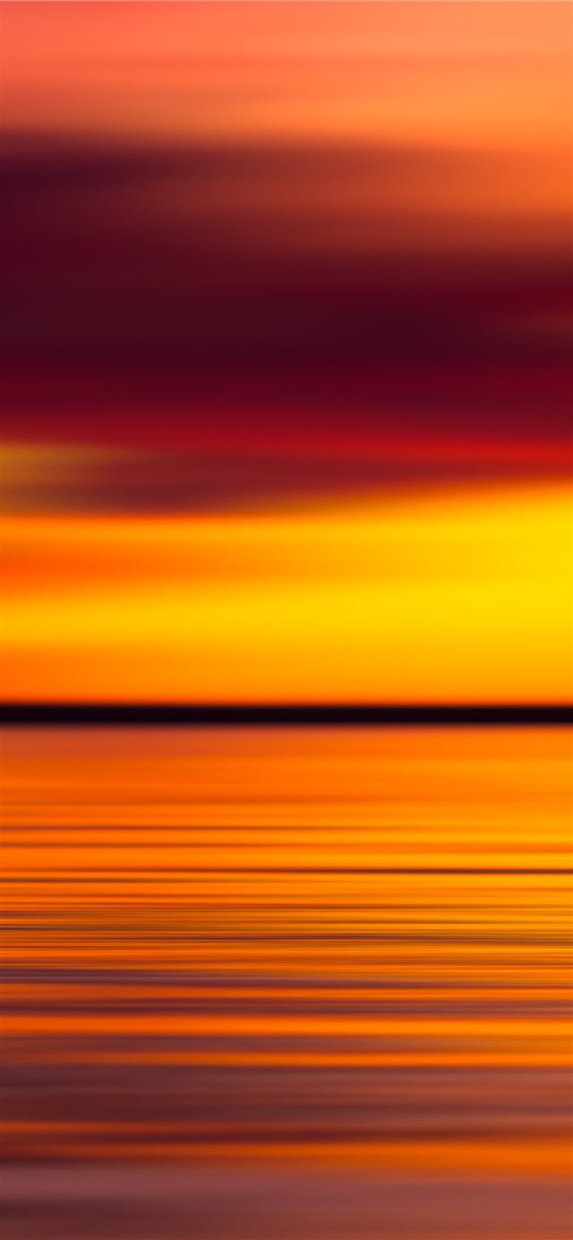body of water during sunset iPhone X wallpaper 