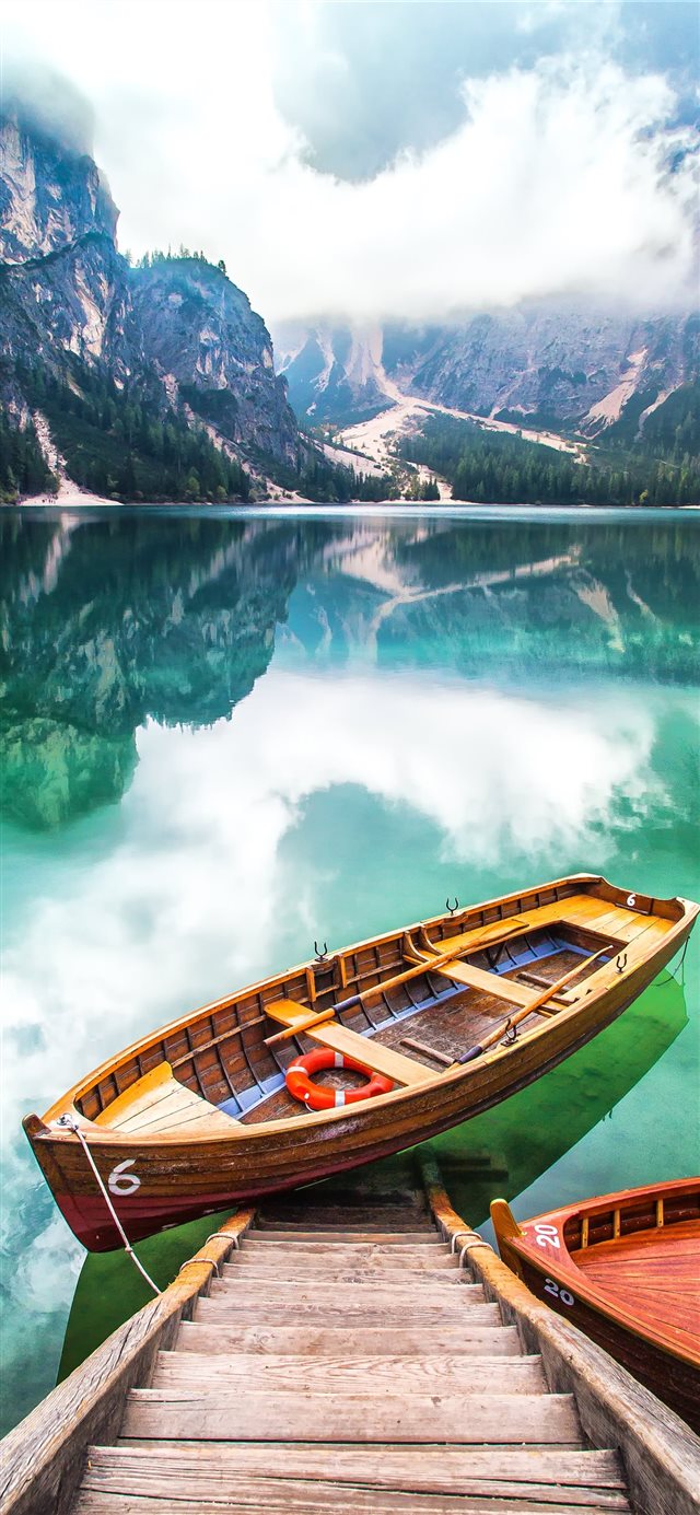 brown gondola on body of water iPhone X wallpaper 