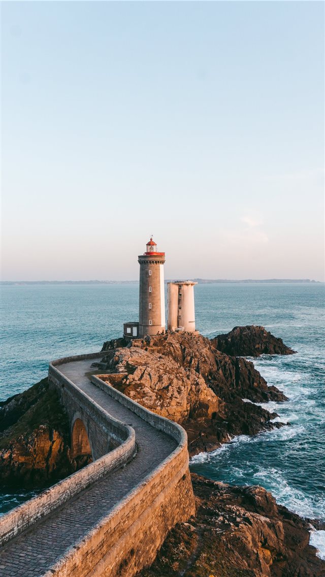 lighthouse near body of water iPhone 8 wallpaper 