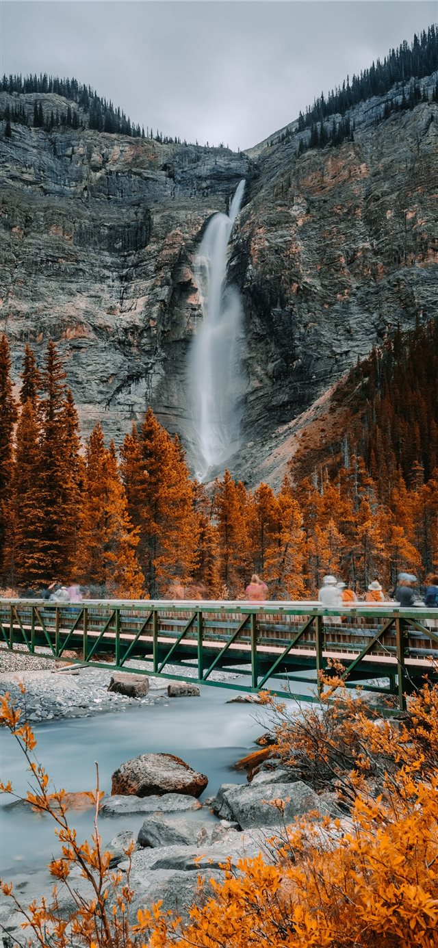 metal bridge near waterfall iPhone X wallpaper 
