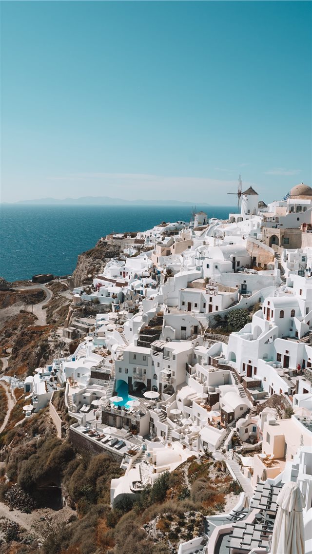 Santorini Greece during daytime iPhone 8 wallpaper 