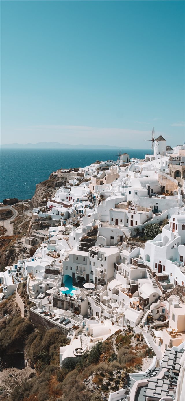 Santorini Greece during daytime iPhone X wallpaper 
