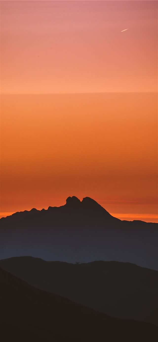 silhouette of mountain during golden hour iPhone X wallpaper 
