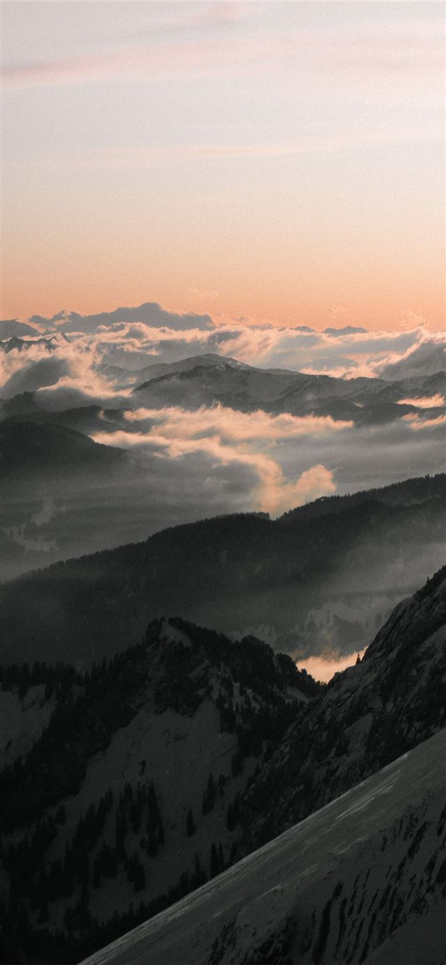 black and white mountains under white clouds durin... iPhone X wallpaper 