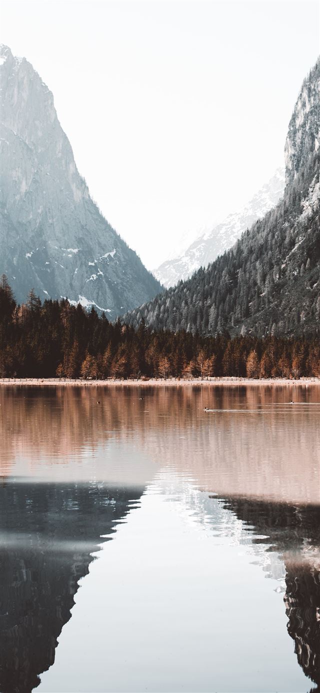calm by of water near mountains iPhone X wallpaper 