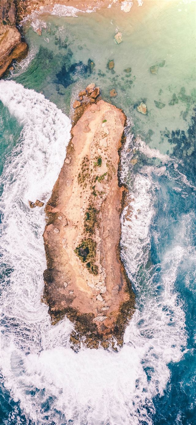 island on body of water during daytime iPhone 11 wallpaper 