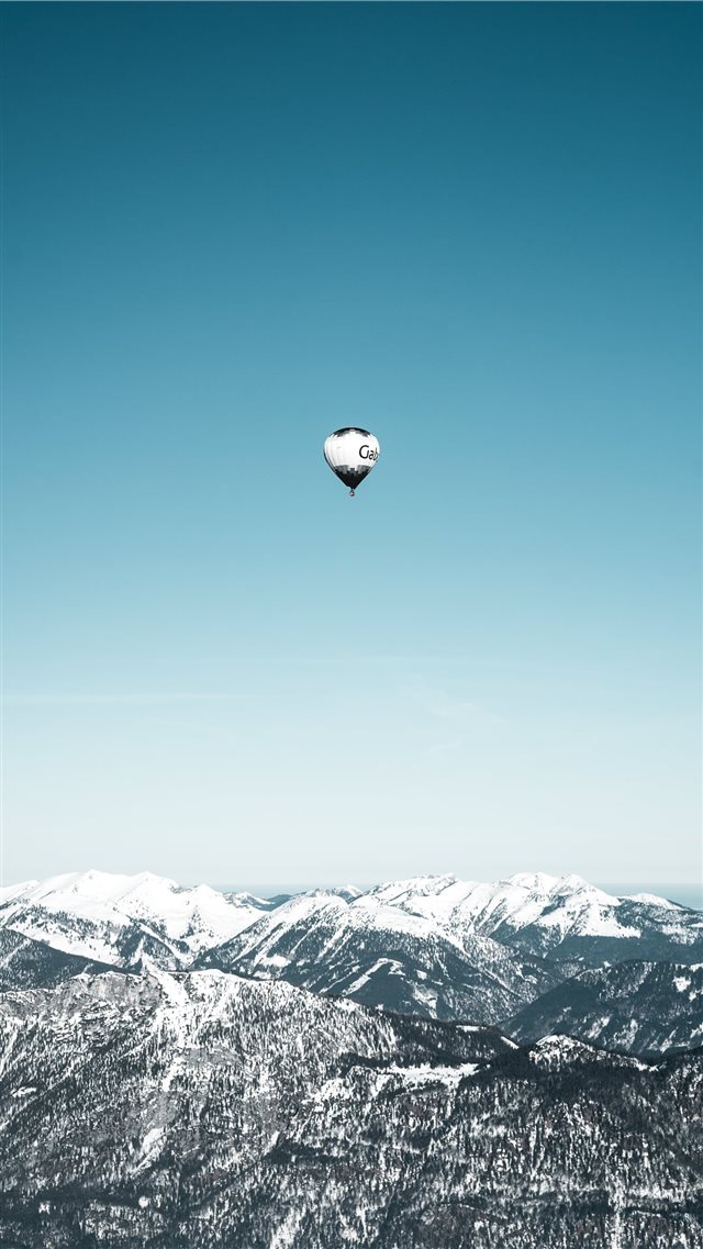 white and black hot air balloons in mid air iPhone 8 wallpaper 