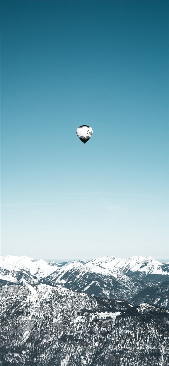 white and black hot air balloons in mid air iPhone 11 wallpaper 