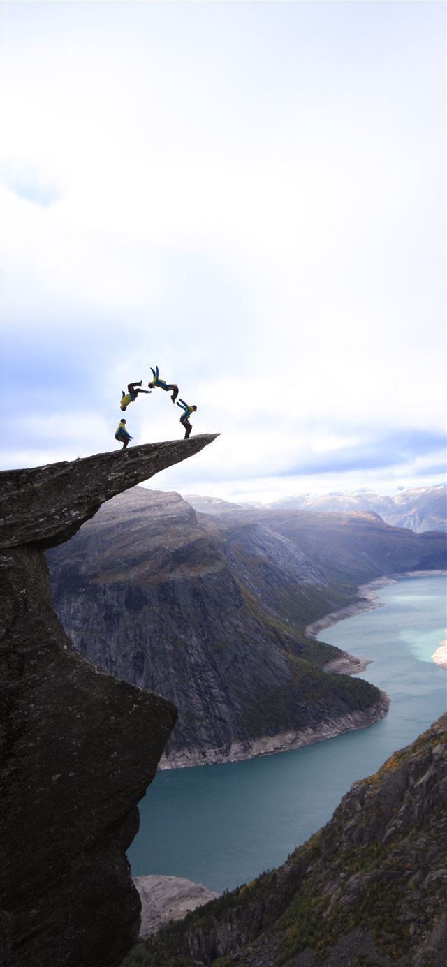 A photoshop of a real jump on Trolltunga Norway iPhone 11 wallpaper 