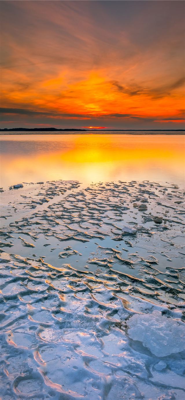 body of water during sunset iPhone 11 wallpaper 
