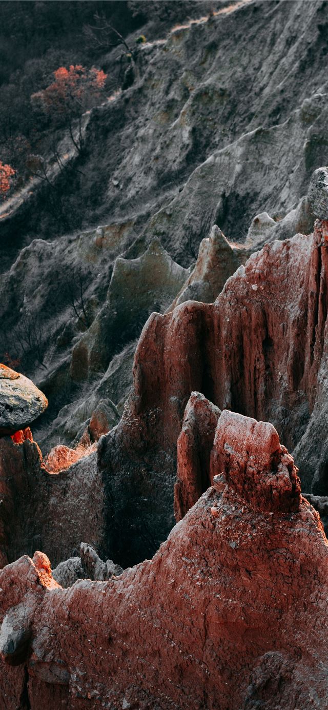 brown rock formation during daytime iPhone X wallpaper 