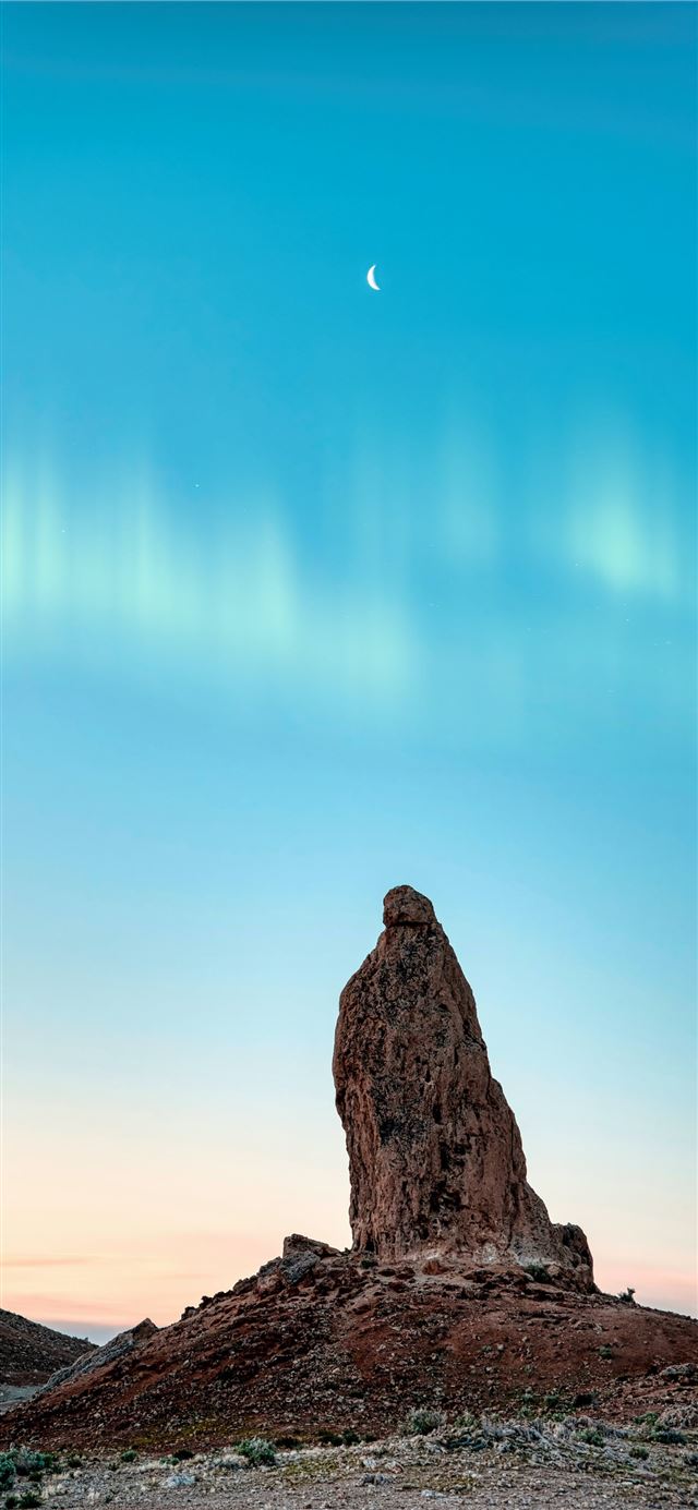 brown rock formation under blue sky during daytime iPhone 11 wallpaper 