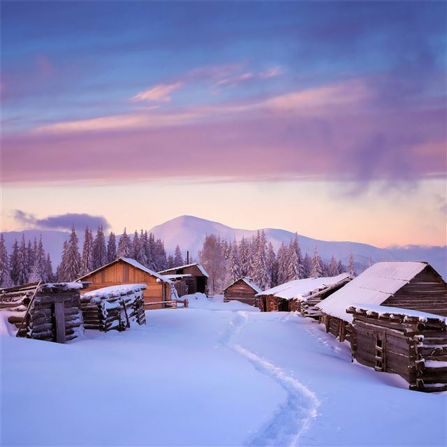 huts covered in snow 4k iPad wallpaper 