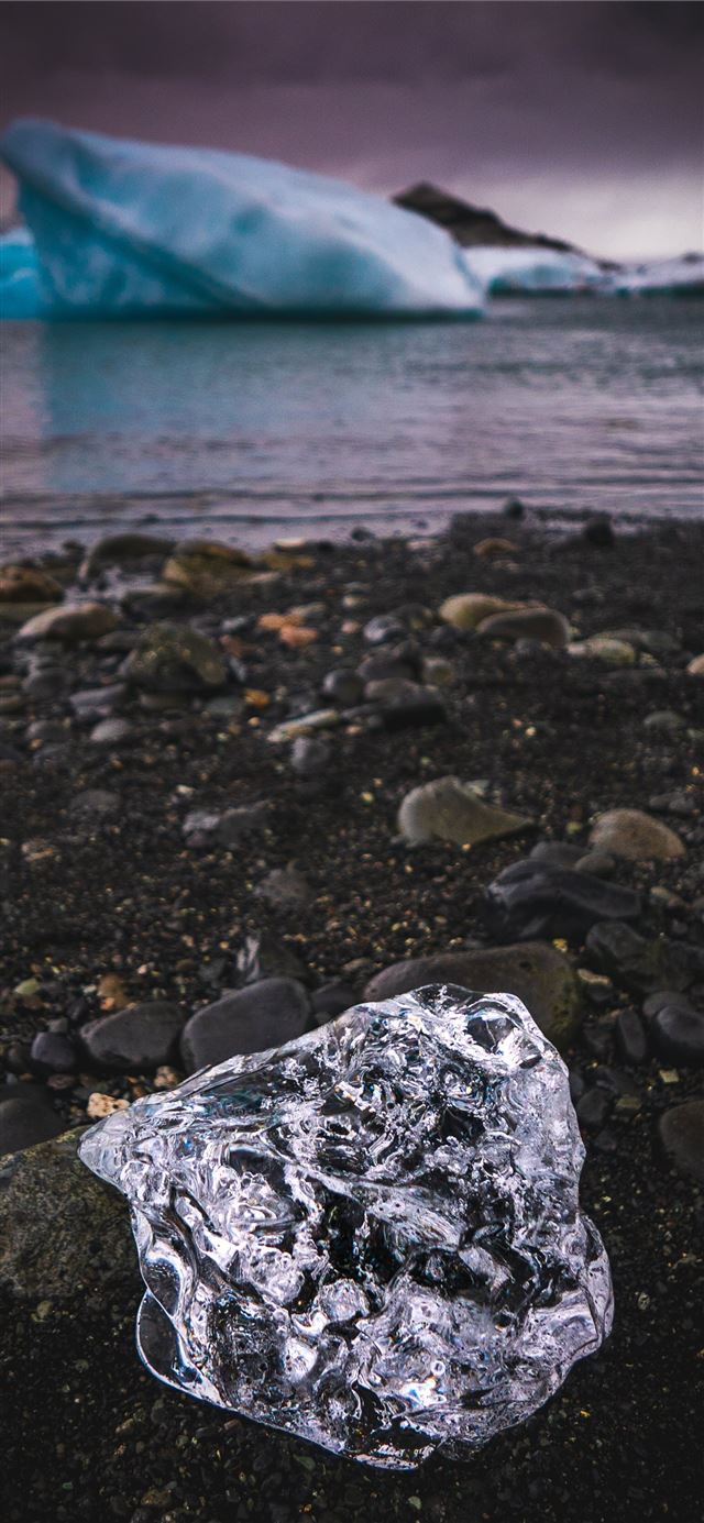 ice on rocky shore iPhone X wallpaper 