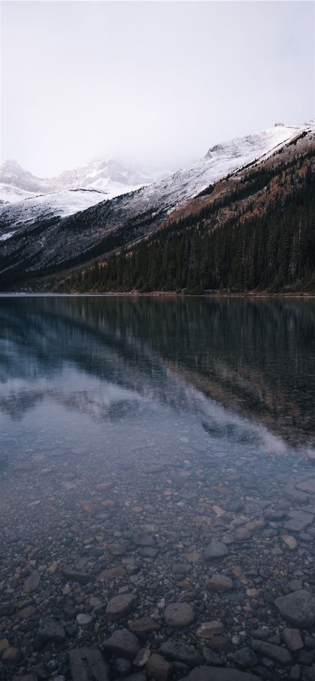 lake near snow covered mountain iPhone X wallpaper 