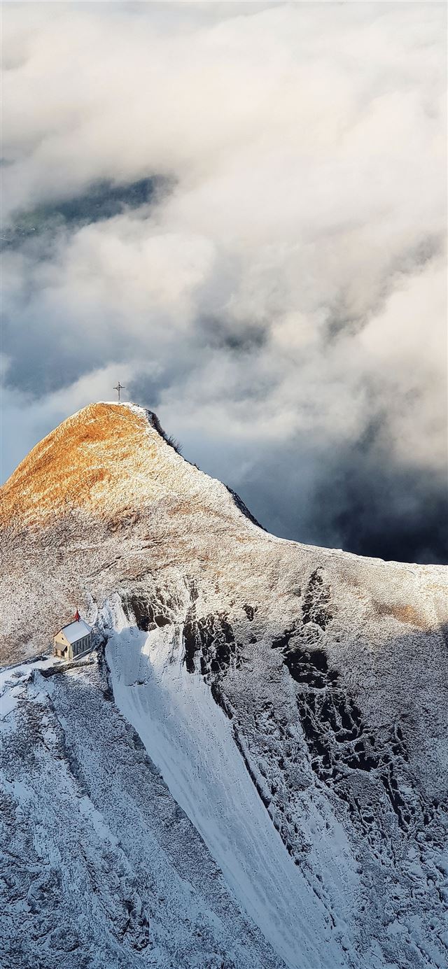 mountain under cloudy sky during daytime iPhone X wallpaper 