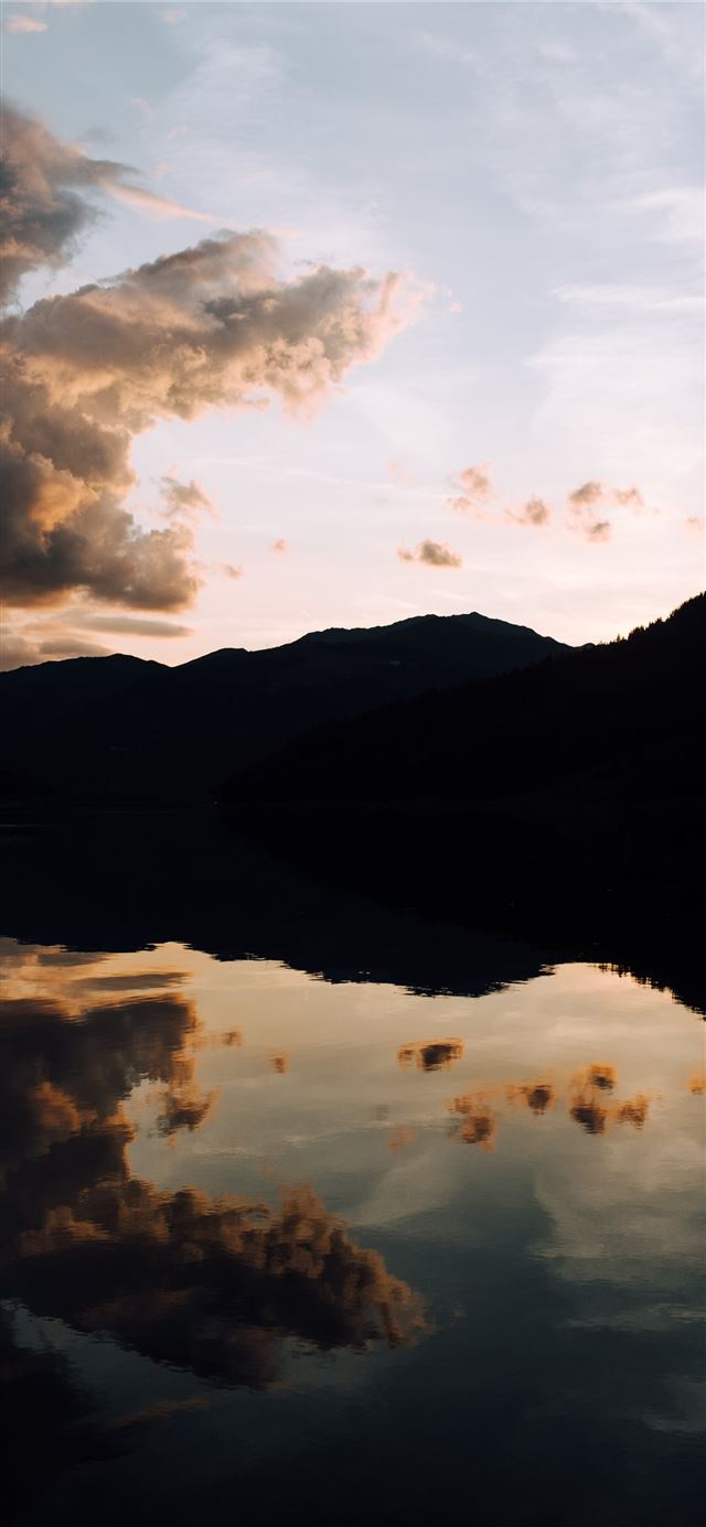silhouette photography of mountain and body of wat... iPhone X wallpaper 