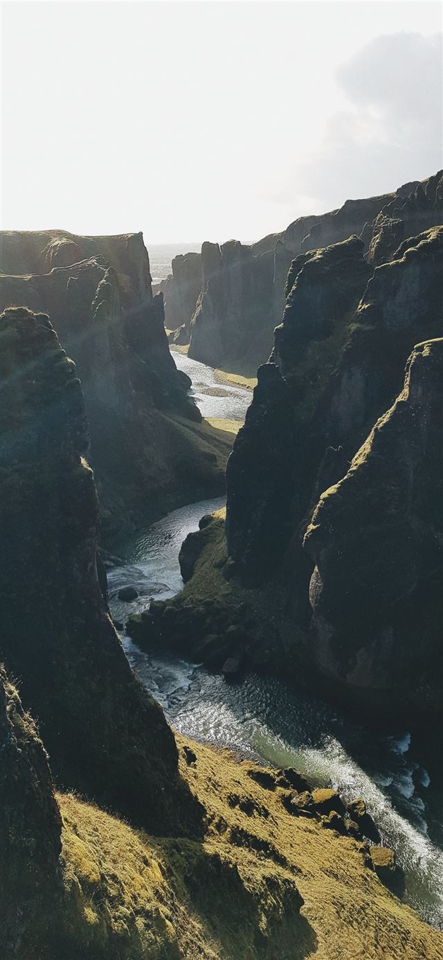 waterfalls surrounded by mountains iPhone 11 wallpaper 