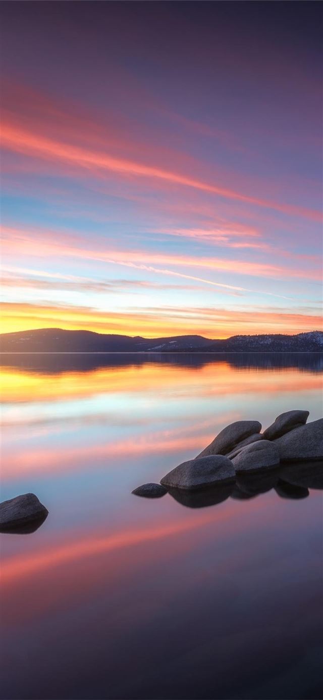 stepping stones on lake tahoes east shore at sunse... iPhone 11 wallpaper 