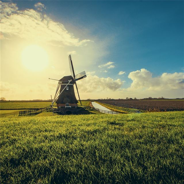 windmill in farmland sunset view 5k iPad Air wallpaper 