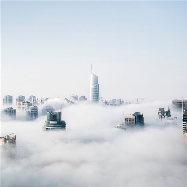 skyscraper buildings covered in fog iPad wallpaper 
