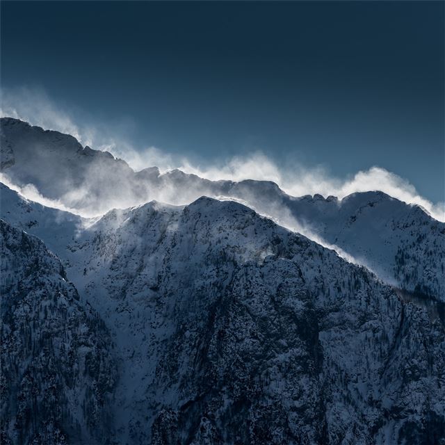 clouds over snow mountain range cliff iPad Air wallpaper 