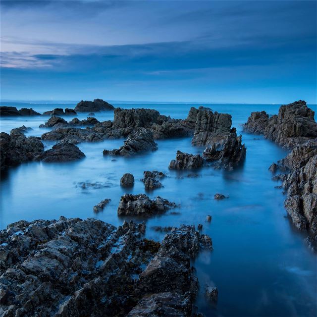 sea rocks evening view 5k iPad Air wallpaper 