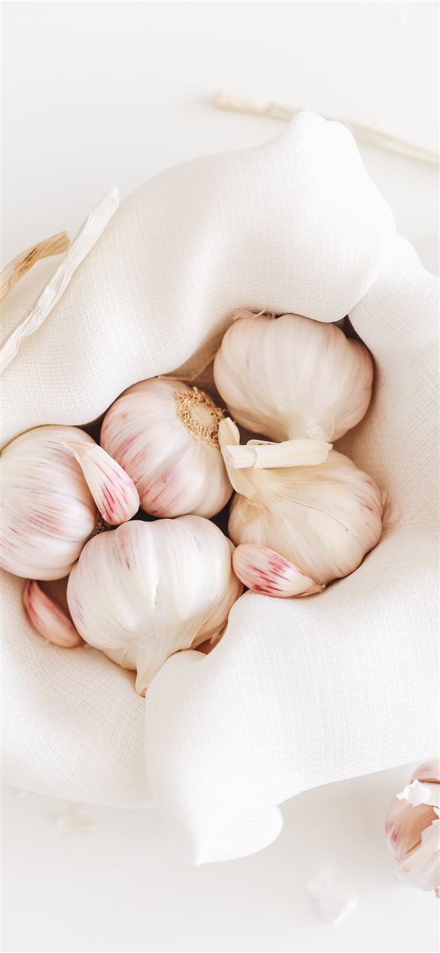 five garlic on white textile iPhone 11 wallpaper 