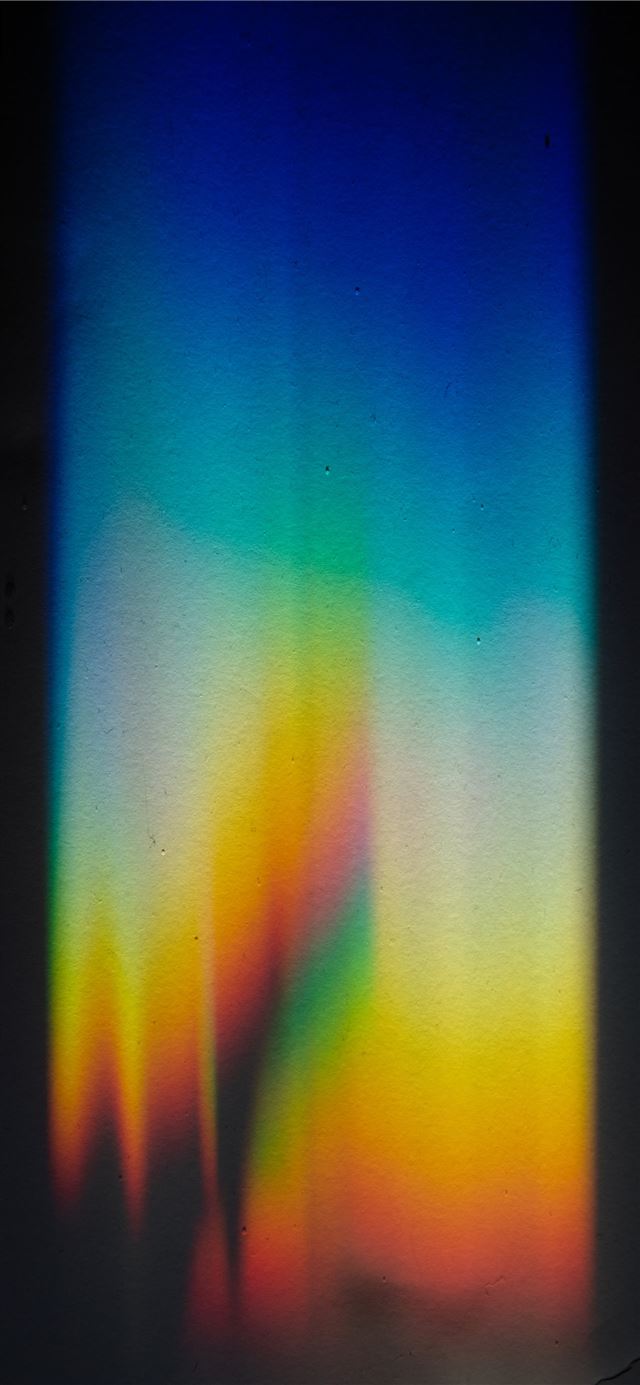 Rainbow light on black background iPhone 11 wallpaper 