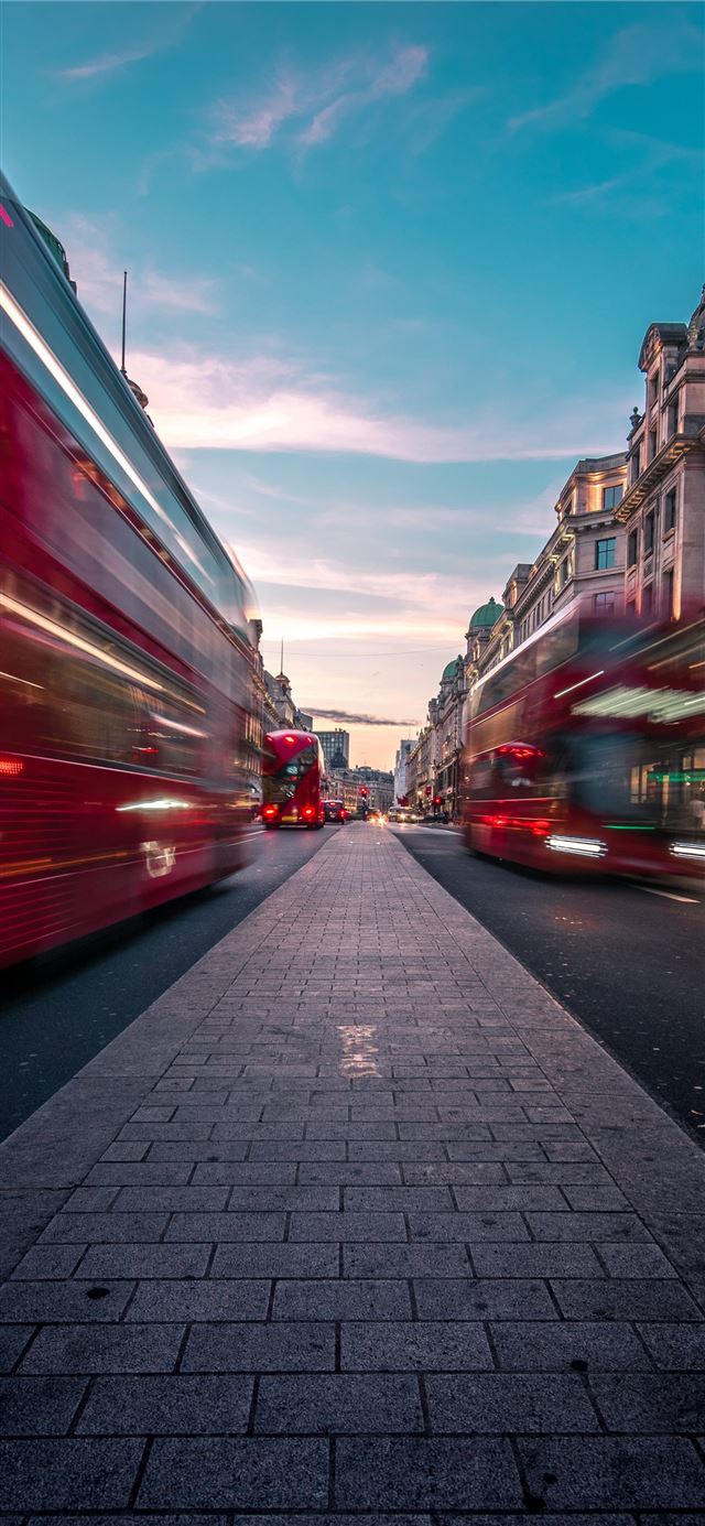 timelapse photography of double decker bus on road... iPhone 11 wallpaper 