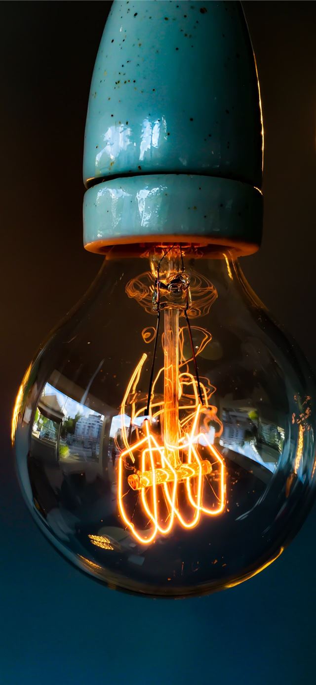 turned on clear glass light bulb iPhone 11 wallpaper 