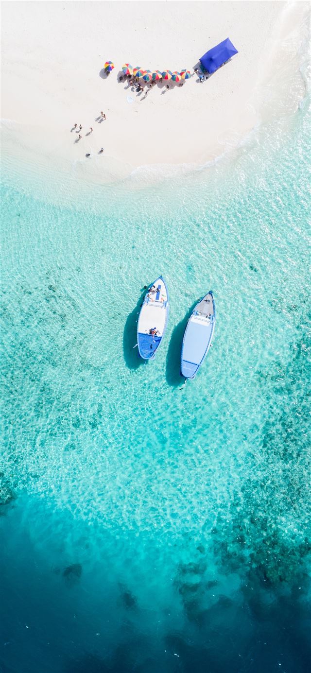 aerial view of two blue boats iPhone 11 wallpaper 