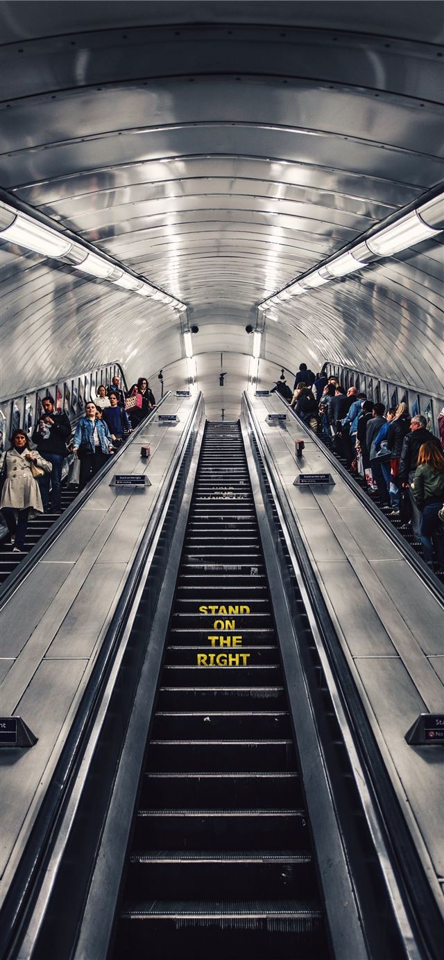 people riding escalator iPhone 11 wallpaper 