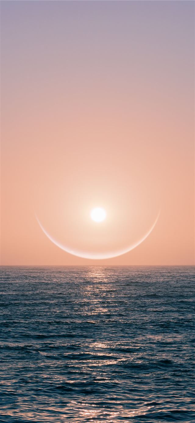 sun over the sea during sunset iPhone 11 wallpaper 