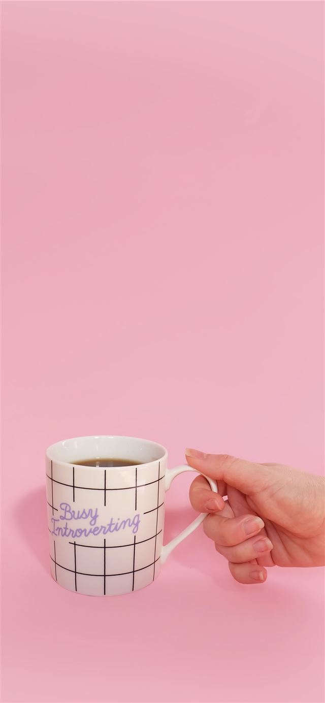 White Mug with a hand iPhone 11 wallpaper 