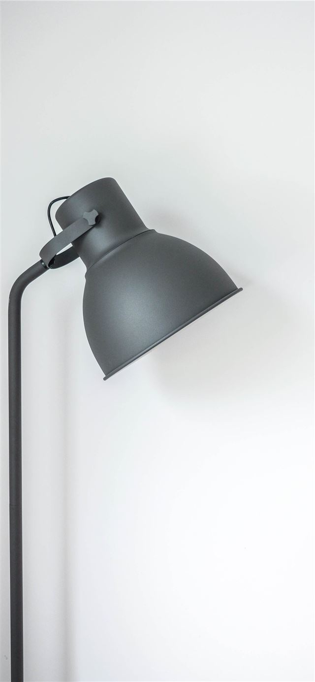 gray desk lamp near white wall iPhone 11 wallpaper 