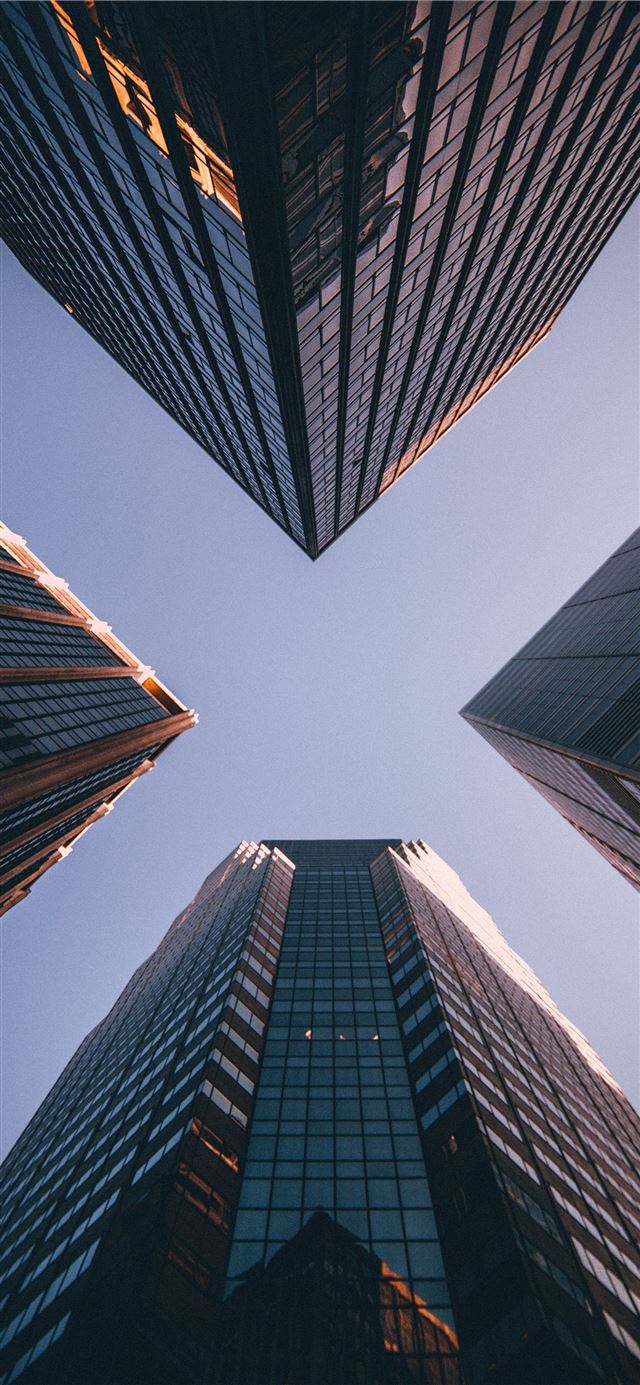 low angle photography of four high rise buildings iPhone 11 wallpaper 