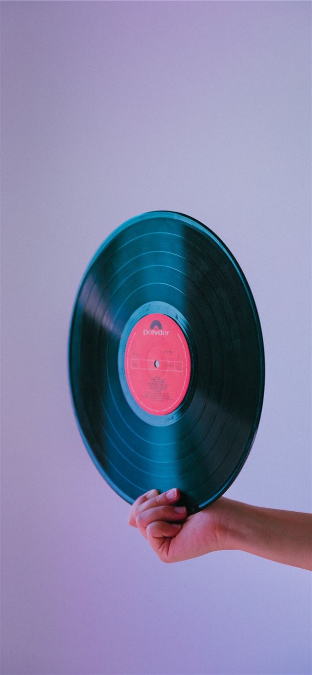 person holding vinyl record iPhone 11 wallpaper 