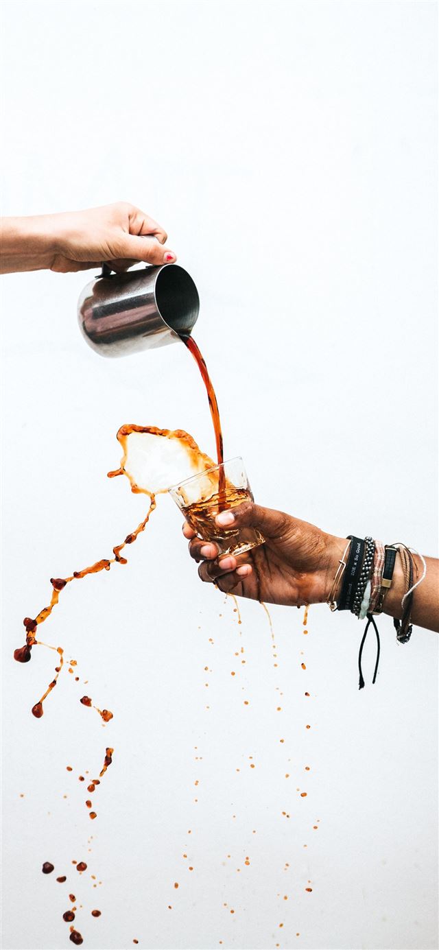 person pouring coffee into glass iPhone 11 wallpaper 