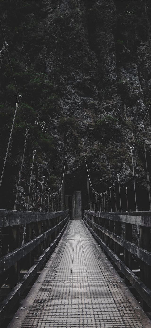 photo of bridge near mountain iPhone 11 wallpaper 