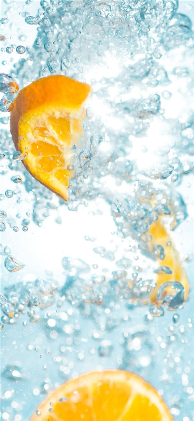sliced orange fruits underwater iPhone 11 wallpaper 
