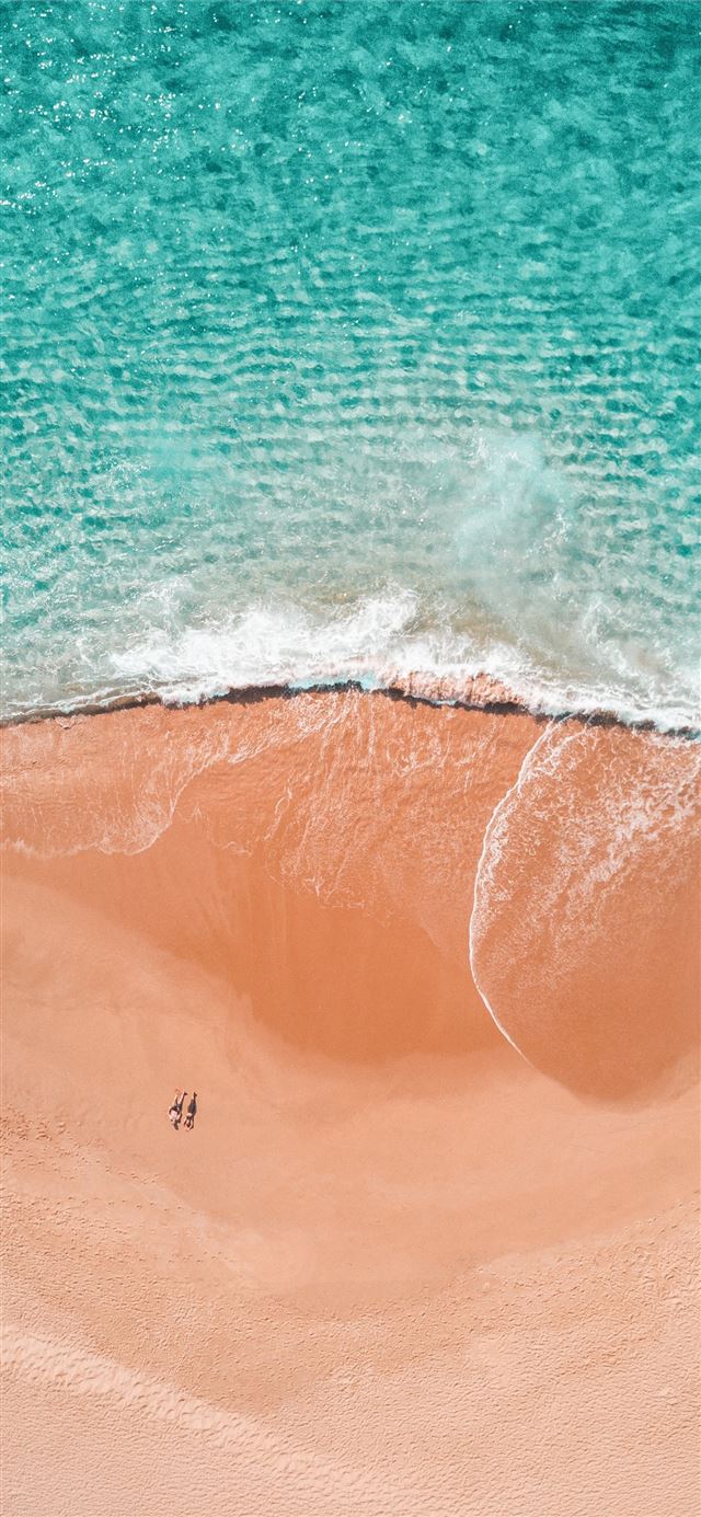 aerial photography of two person sunbathing on sea... iPhone 11 wallpaper 