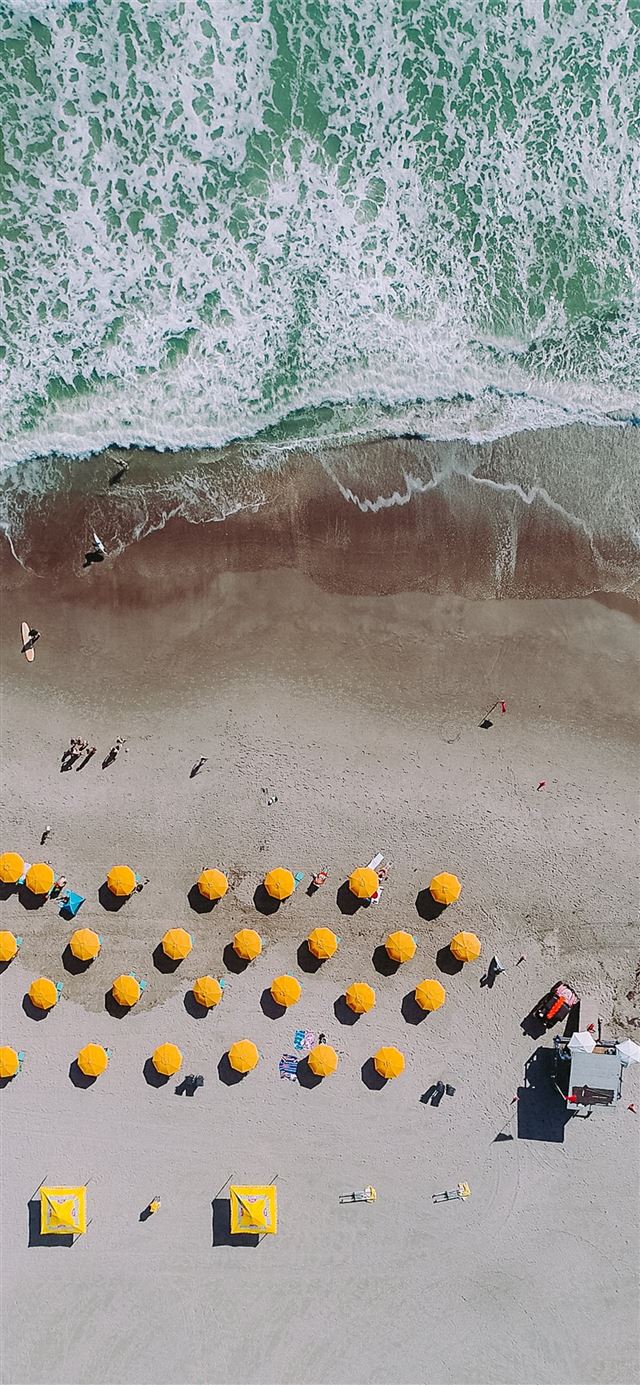 aerial photography of umbrellas on beach iPhone 11 wallpaper 