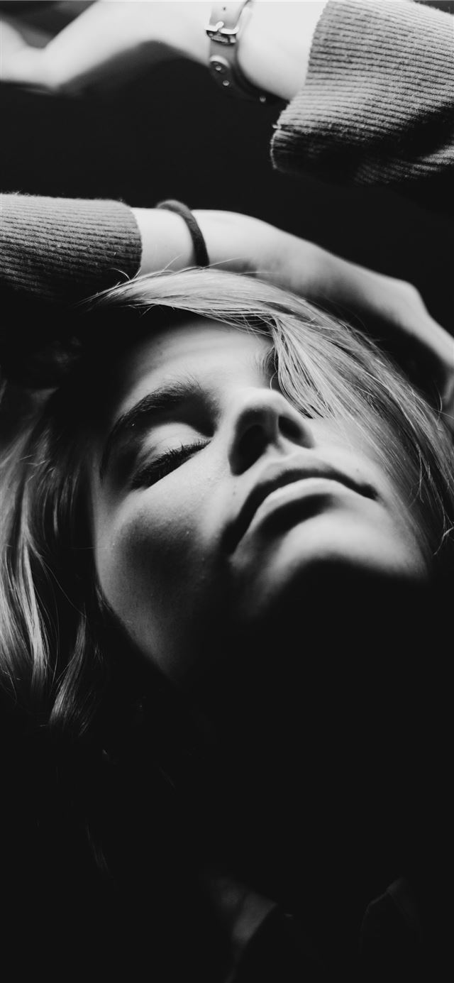 grayscale photography of closed eyes woman while r... iPhone 11 wallpaper 