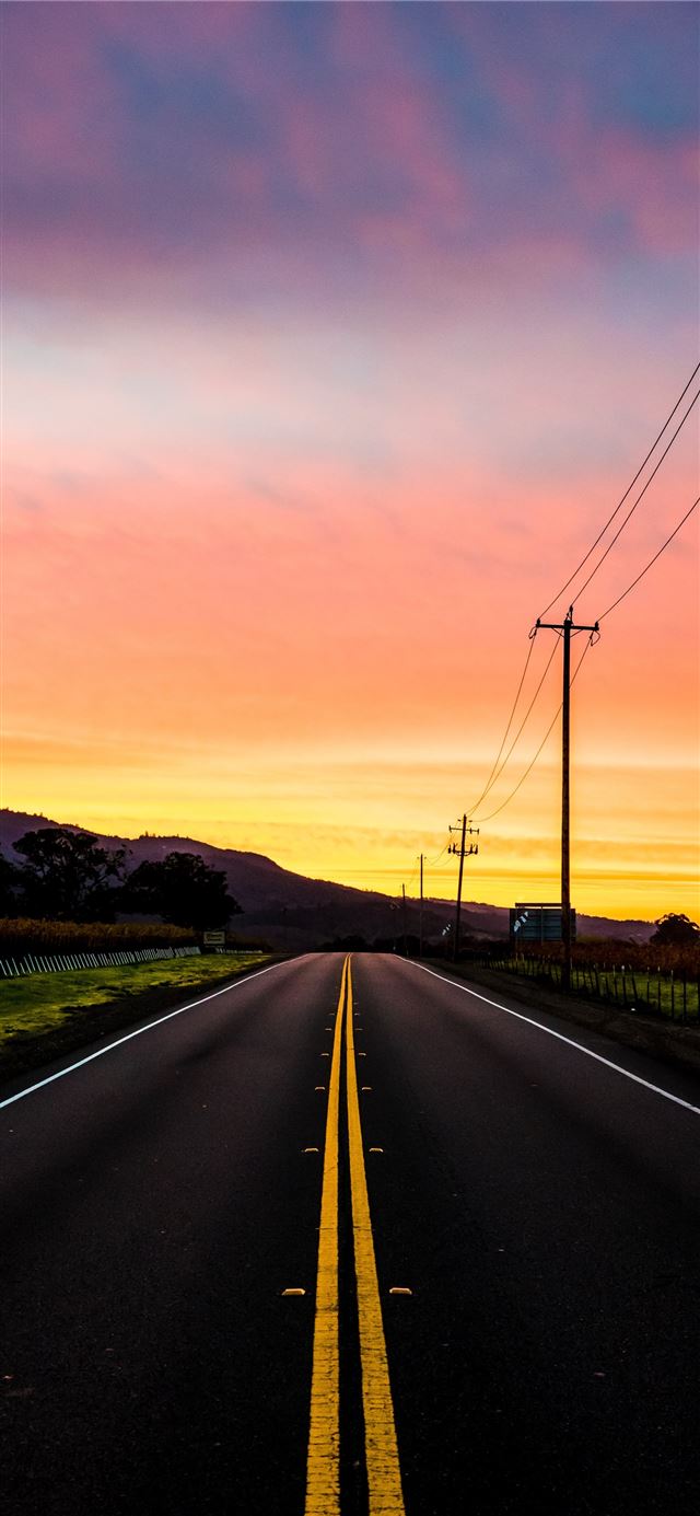 photo of road near mountain iPhone 11 wallpaper 